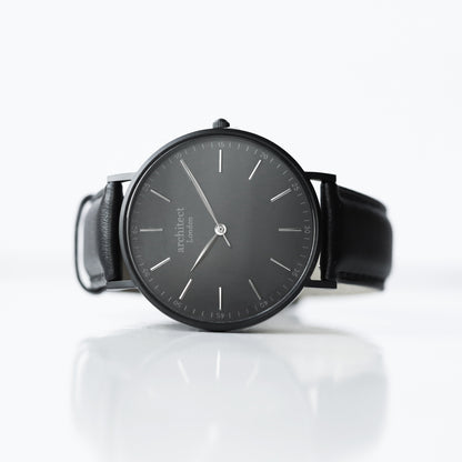 Personalised minimalist watch with jet black leather strap and engraving
