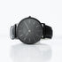 Personalised minimalist watch with jet black leather strap and engraving